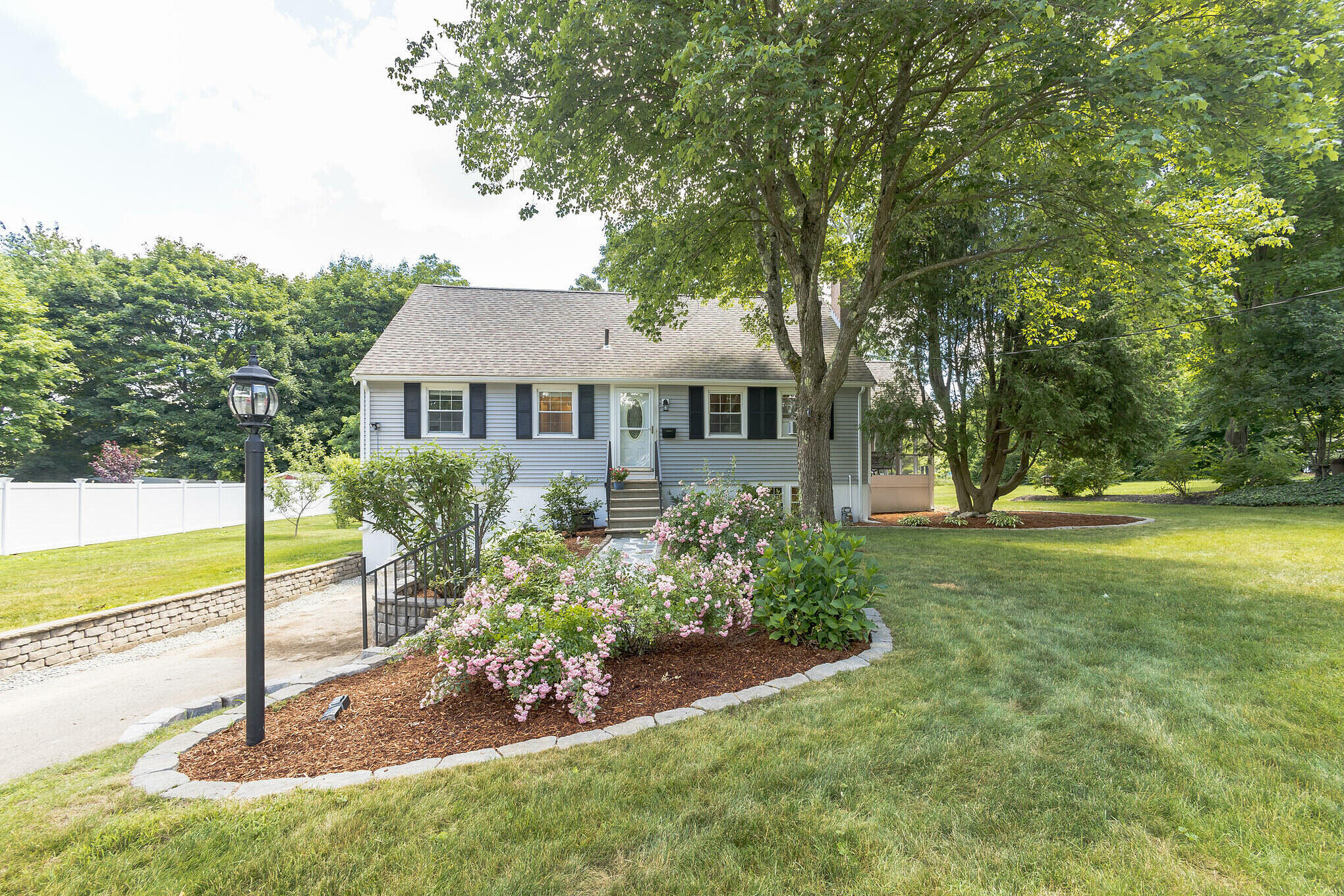 a front view of a house with garden