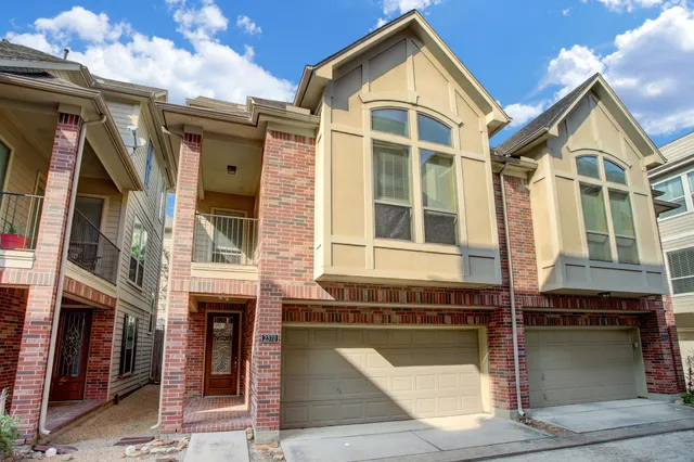 a view of a two chairs in the back yard