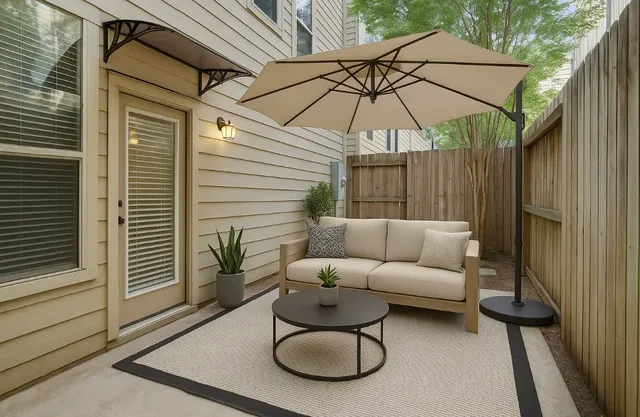 a bedroom with a bed a couch and a window