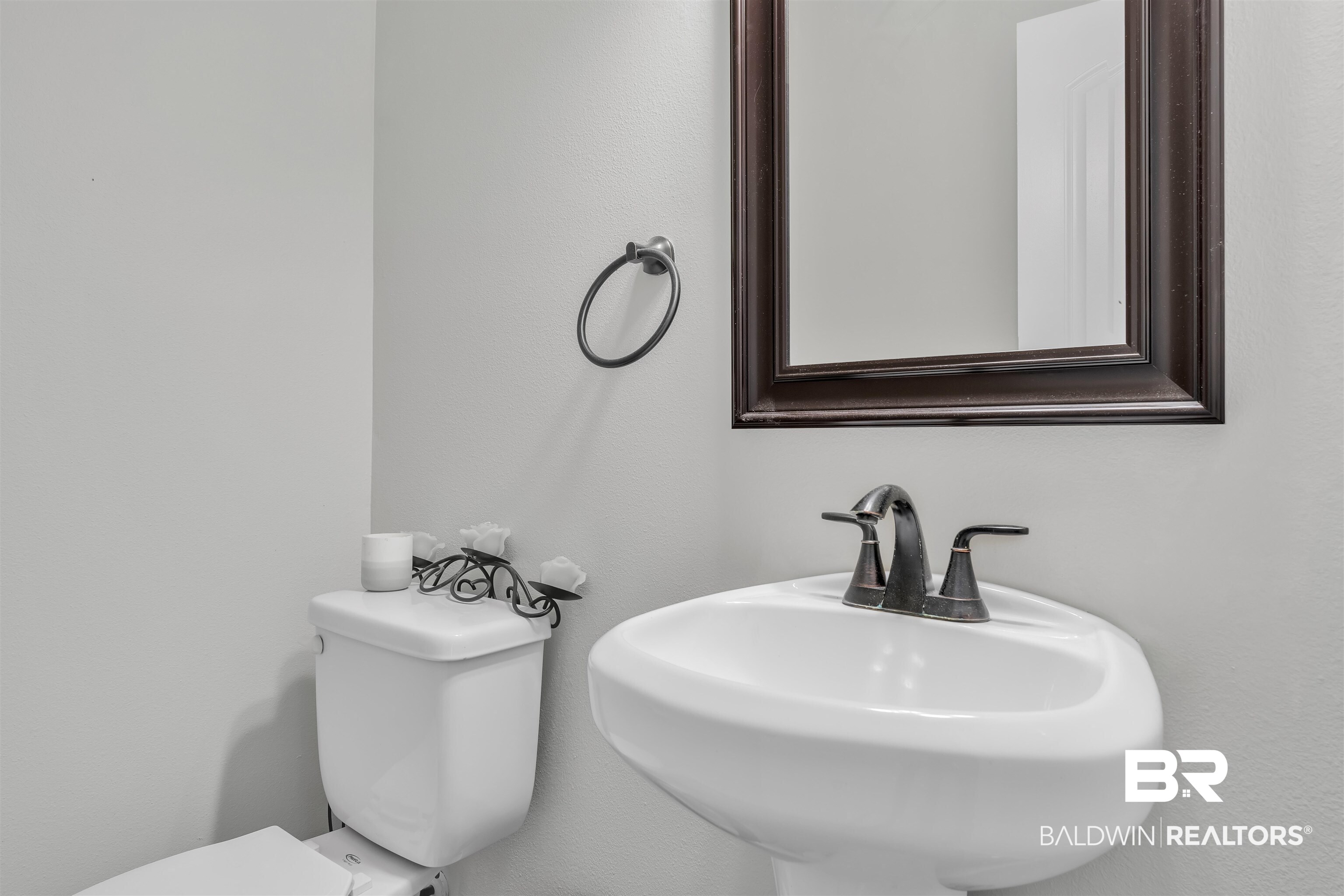 22565 Nana Loop East Silverhill, AL 36576 - Photo 20 of 26 Half bath featuring toilet and a sink