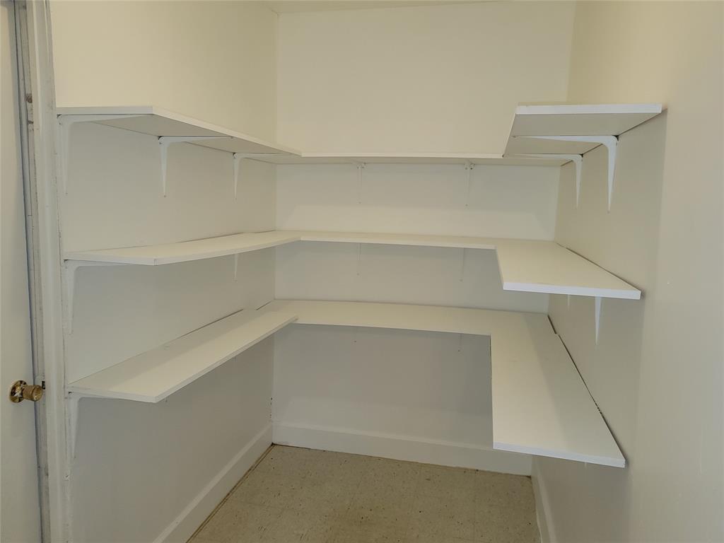 1000 Springdale Road Bedford, TX 76021 - Photo 8 of 36 Separate pantry or additional storage room is connected to the HVAC system, and leads to the garage.