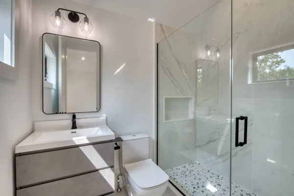 a utility room with sink dryer and washer