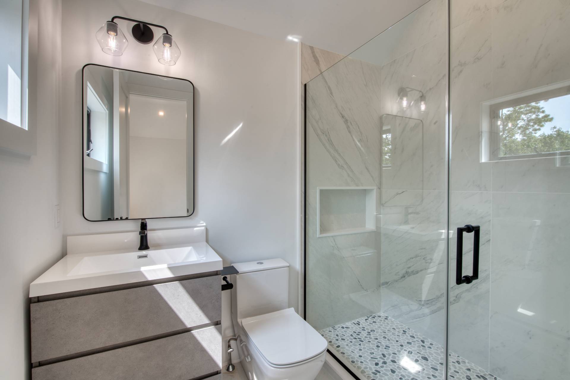 62 Whooping Hollow Road East Hampton, NY 11937 - Photo 16 of 29 a bathroom with a toilet a sink and shower