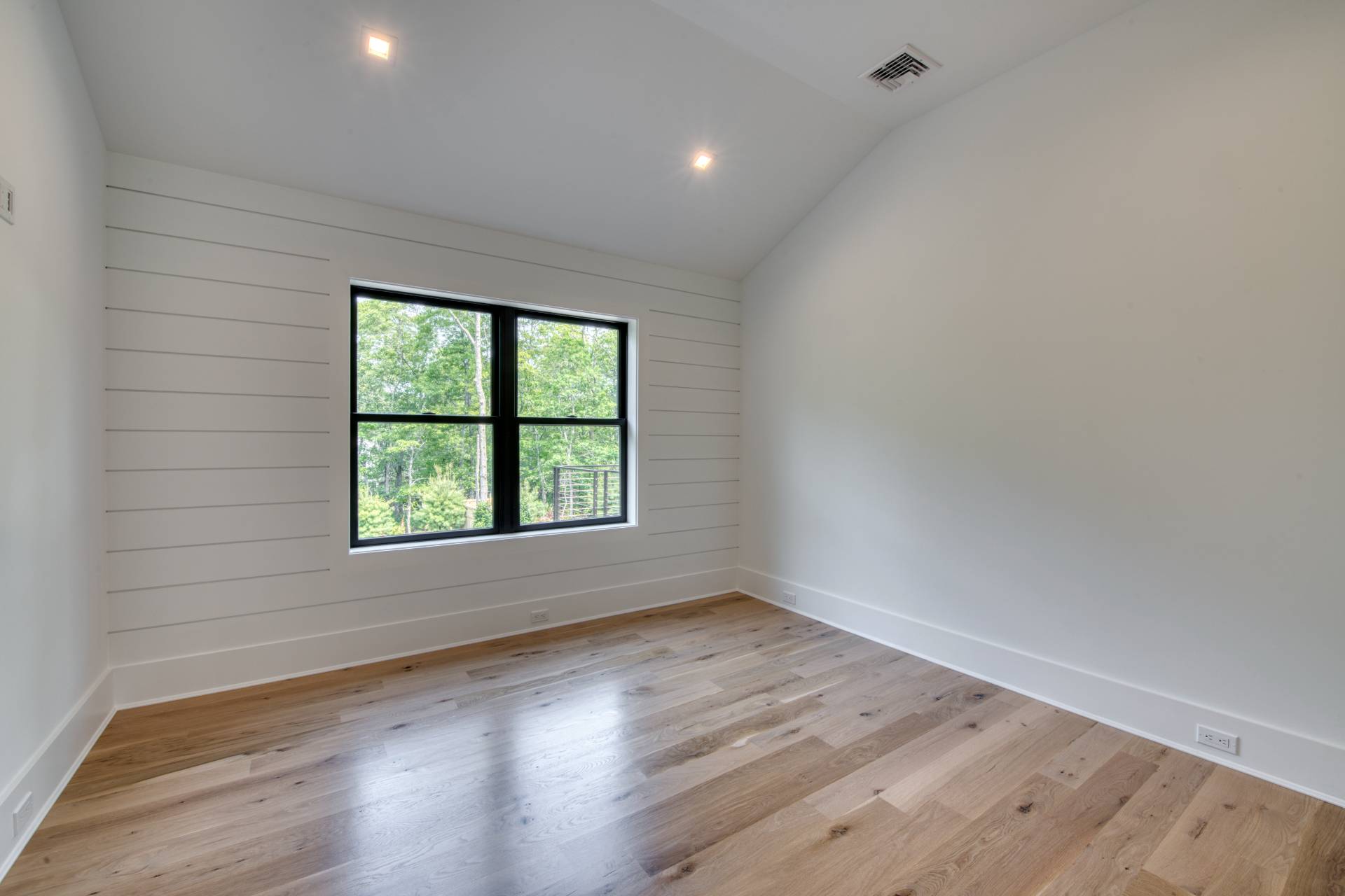 62 Whooping Hollow Road East Hampton, NY 11937 - Photo 17 of 29 an empty room with wooden floor and windows