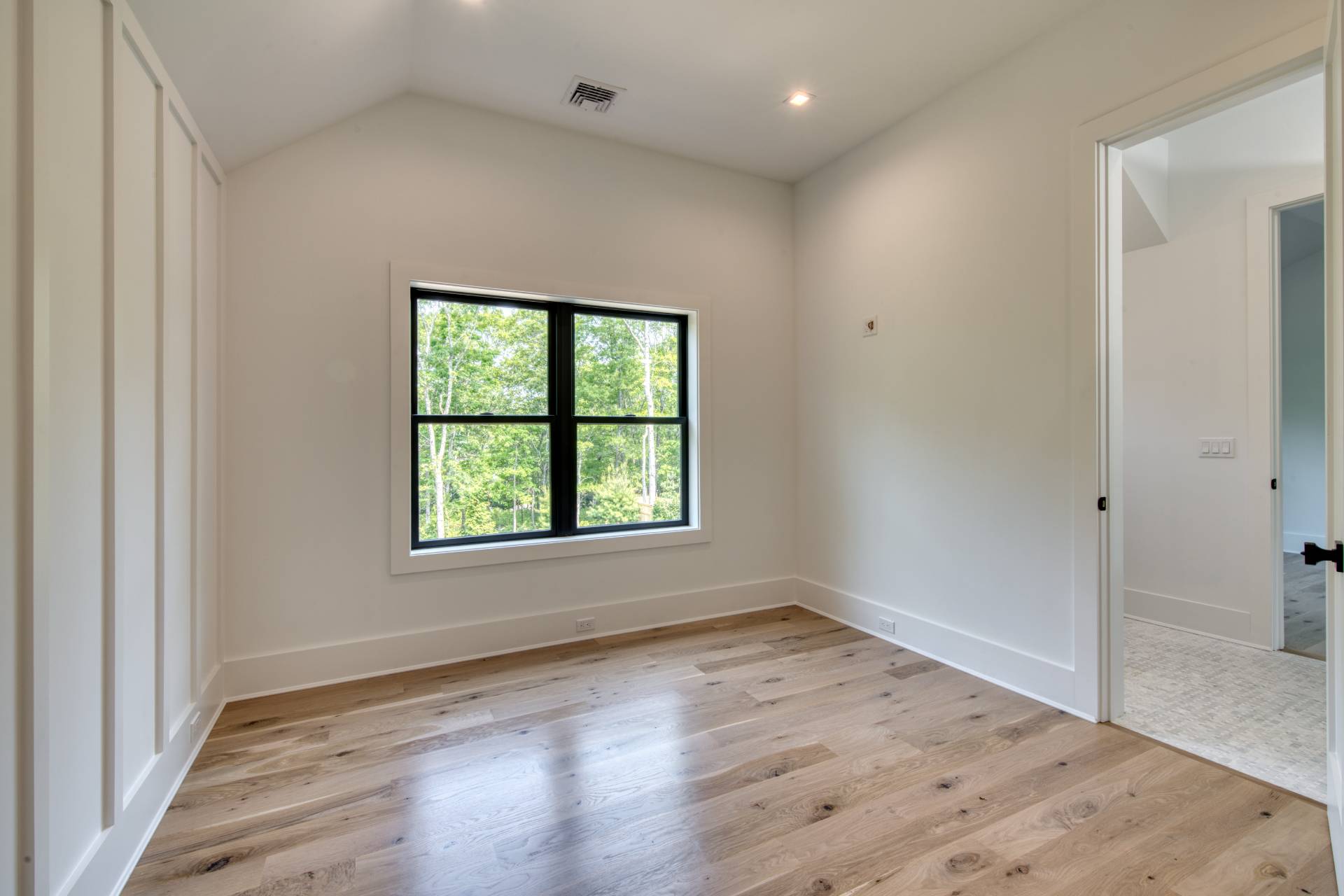 62 Whooping Hollow Road East Hampton, NY 11937 - Photo 19 of 29 an empty room with wooden floor and windows