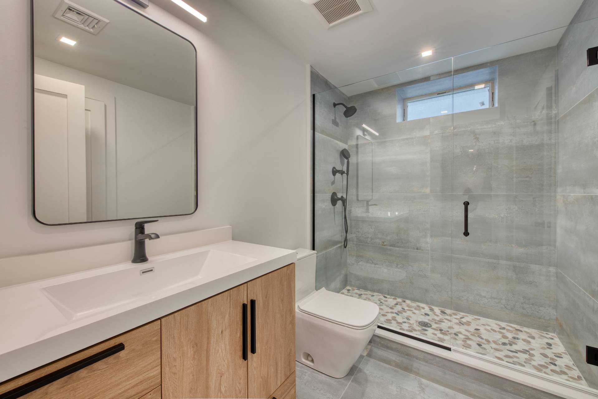 62 Whooping Hollow Road East Hampton, NY 11937 - Photo 22 of 29 a bathroom with a sink a toilet and shower