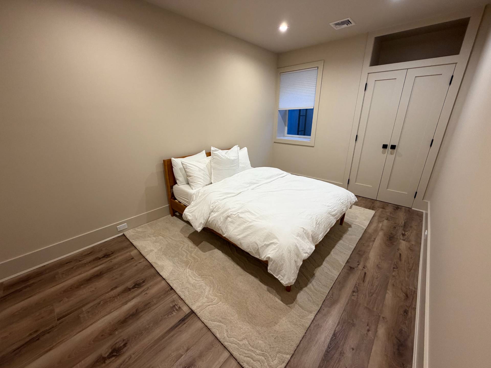62 Whooping Hollow Road East Hampton, NY 11937 - Photo 23 of 31 a bedroom with a bed and window