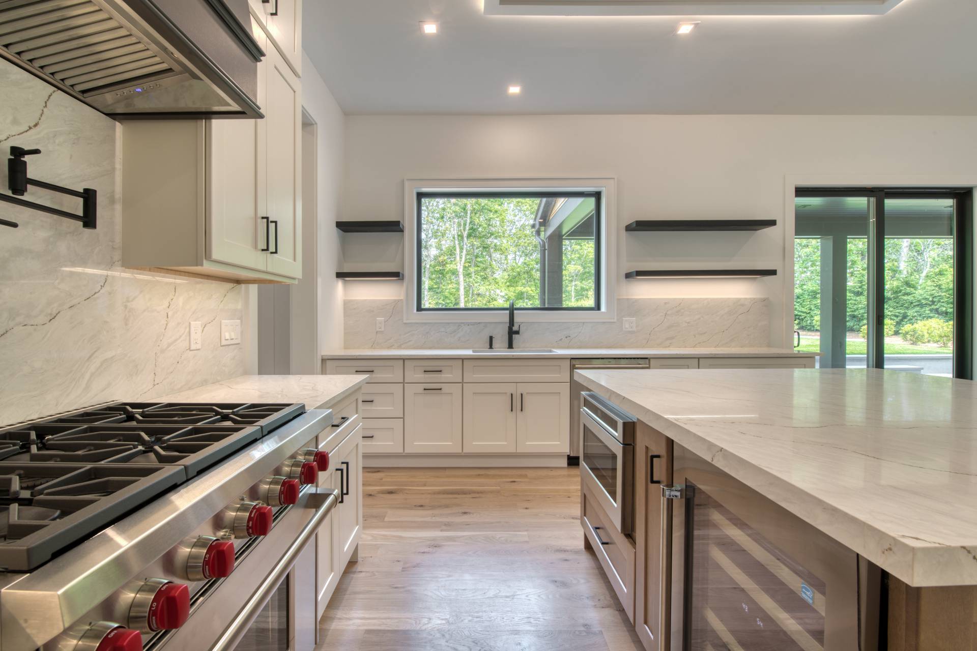 62 Whooping Hollow Road East Hampton, NY 11937 - Photo 7 of 29 a kitchen with stainless steel appliances granite countertop a sink and a stove