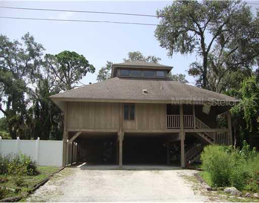 756 Trojan Road Venice, FL 34293 - Photo 1 of 1 a front view of a house with a yard