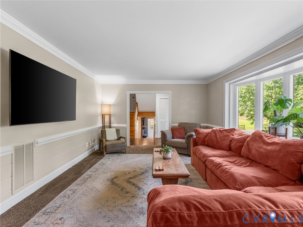 13099 Cedon Road Ashland, VA 23005 - Photo 30 of 92 Living room is carpeted with beautiful moulding an