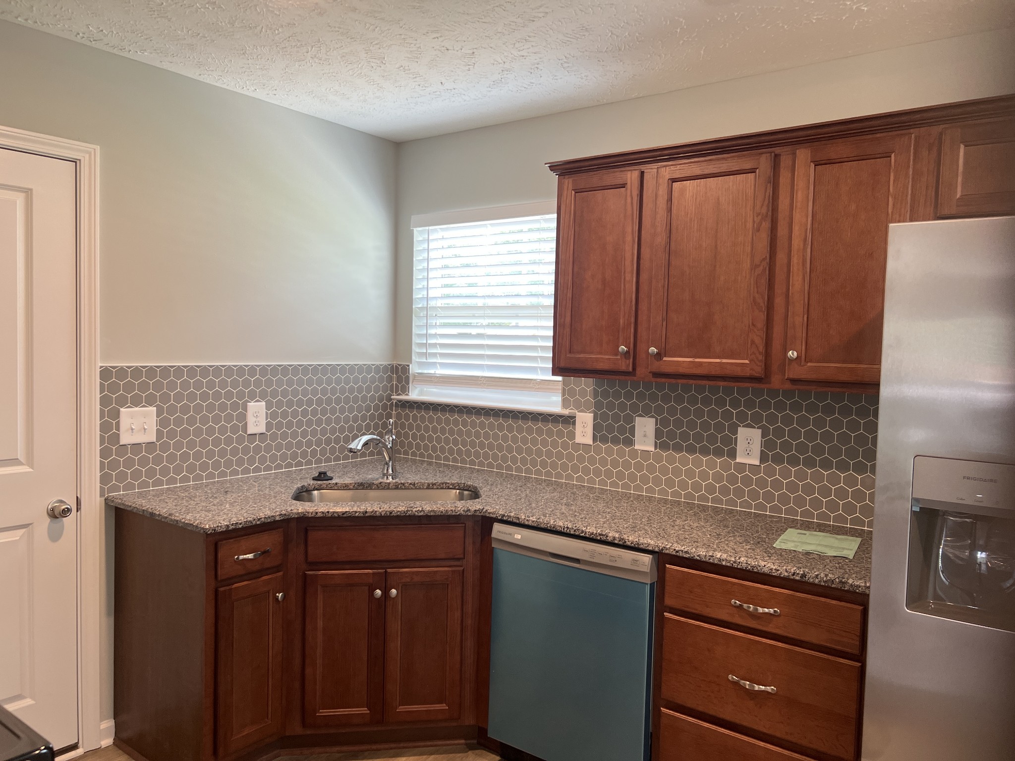 92 Timber Circle Manchester, TN 37355 - Photo 11 of 21 a kitchen with stainless steel appliances granite countertop wooden cabinets a sink and dishwasher