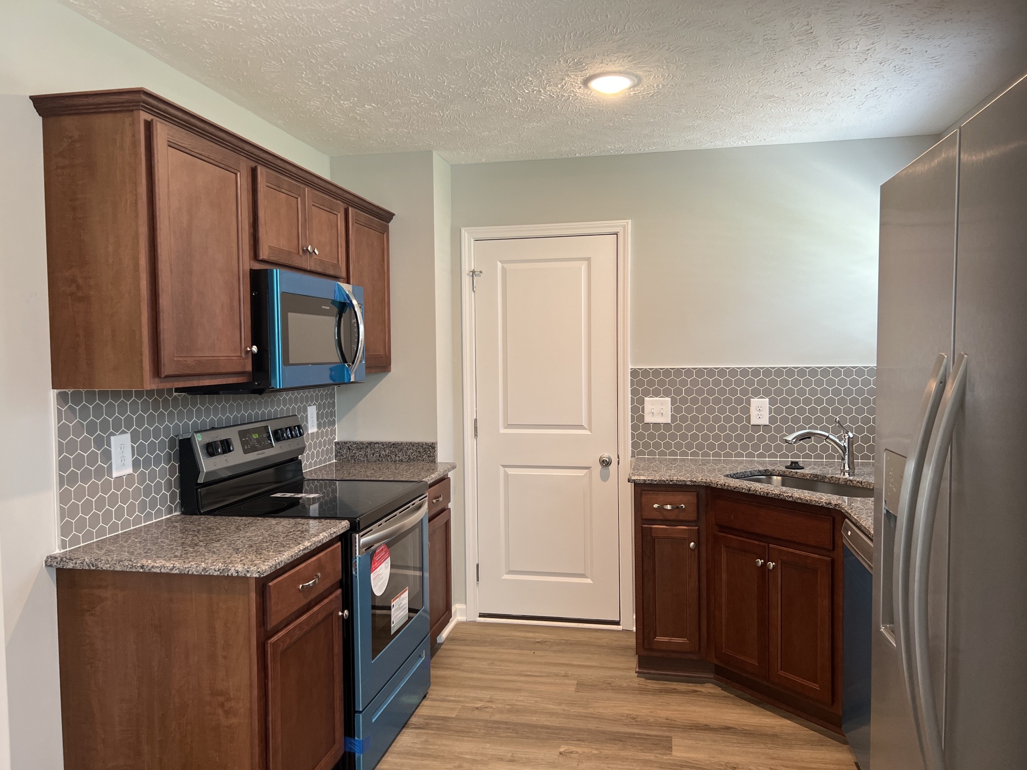92 Timber Circle Manchester, TN 37355 - Photo 12 of 21 a kitchen with a stove and a microwave