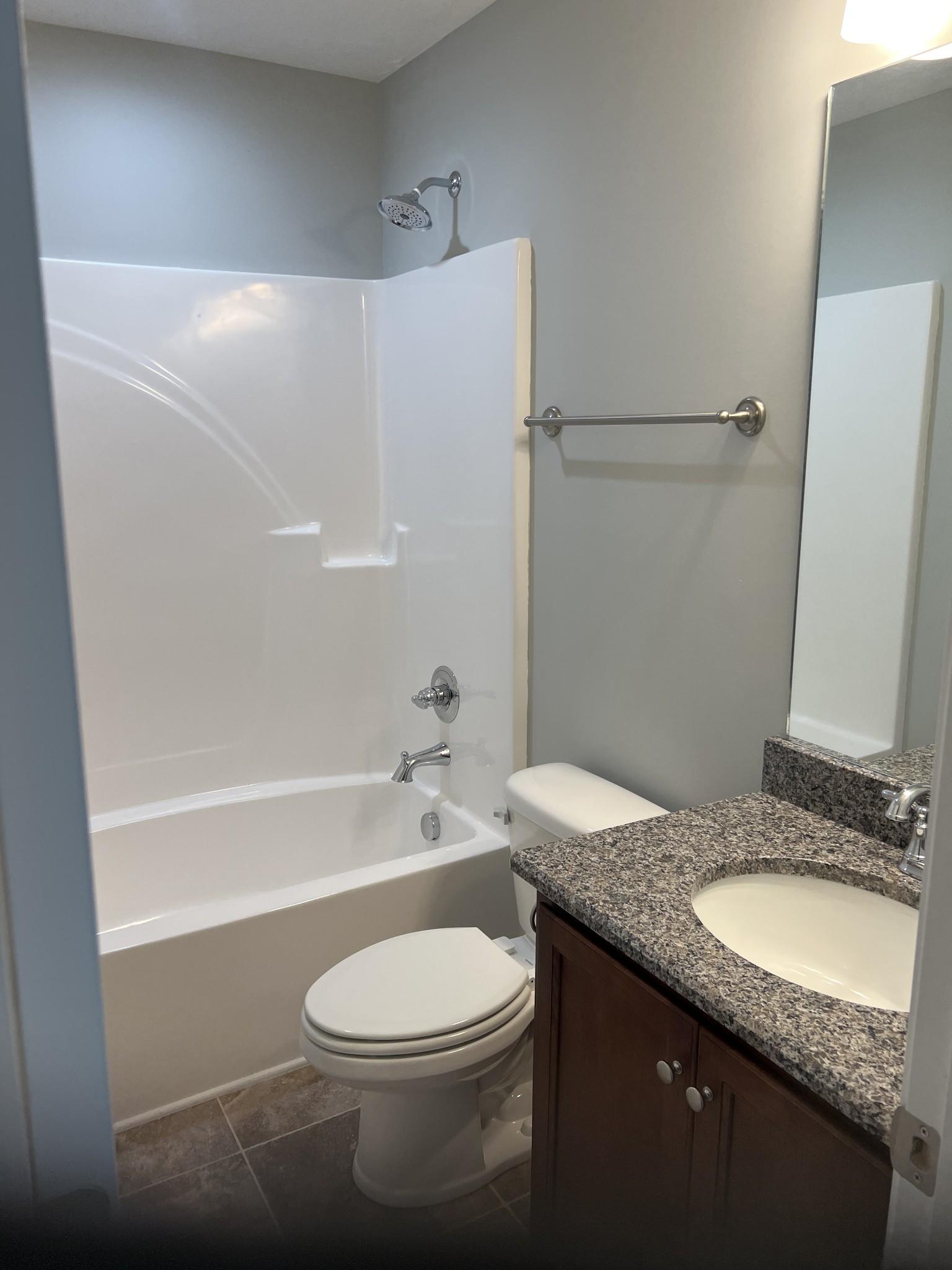 92 Timber Circle Manchester, TN 37355 - Photo 18 of 21 a bathroom with a granite countertop sink toilet a mirror and shower