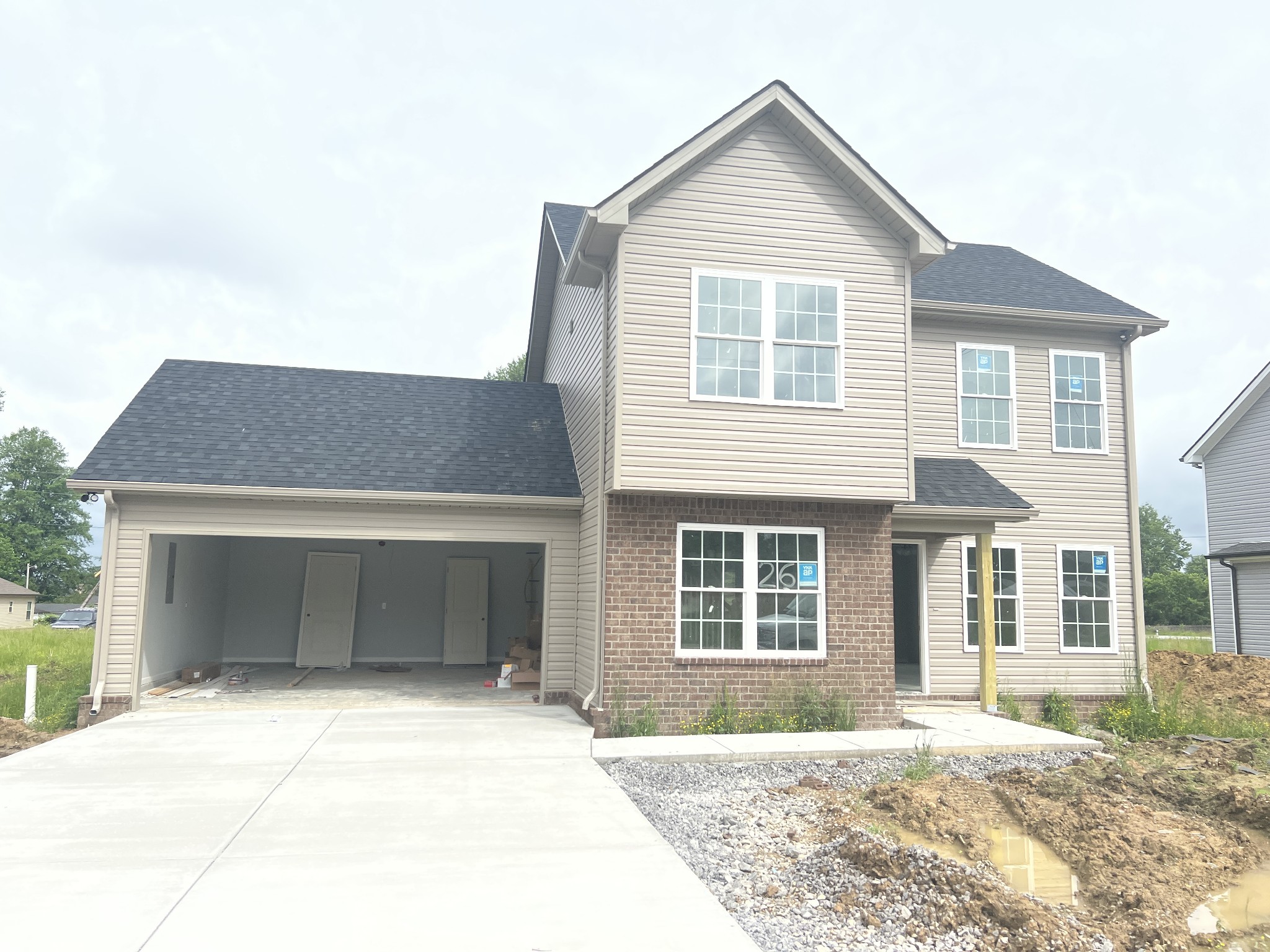 92 Timber Circle Manchester, TN 37355 - Photo 3 of 21 a front view of a house with a yard and garage