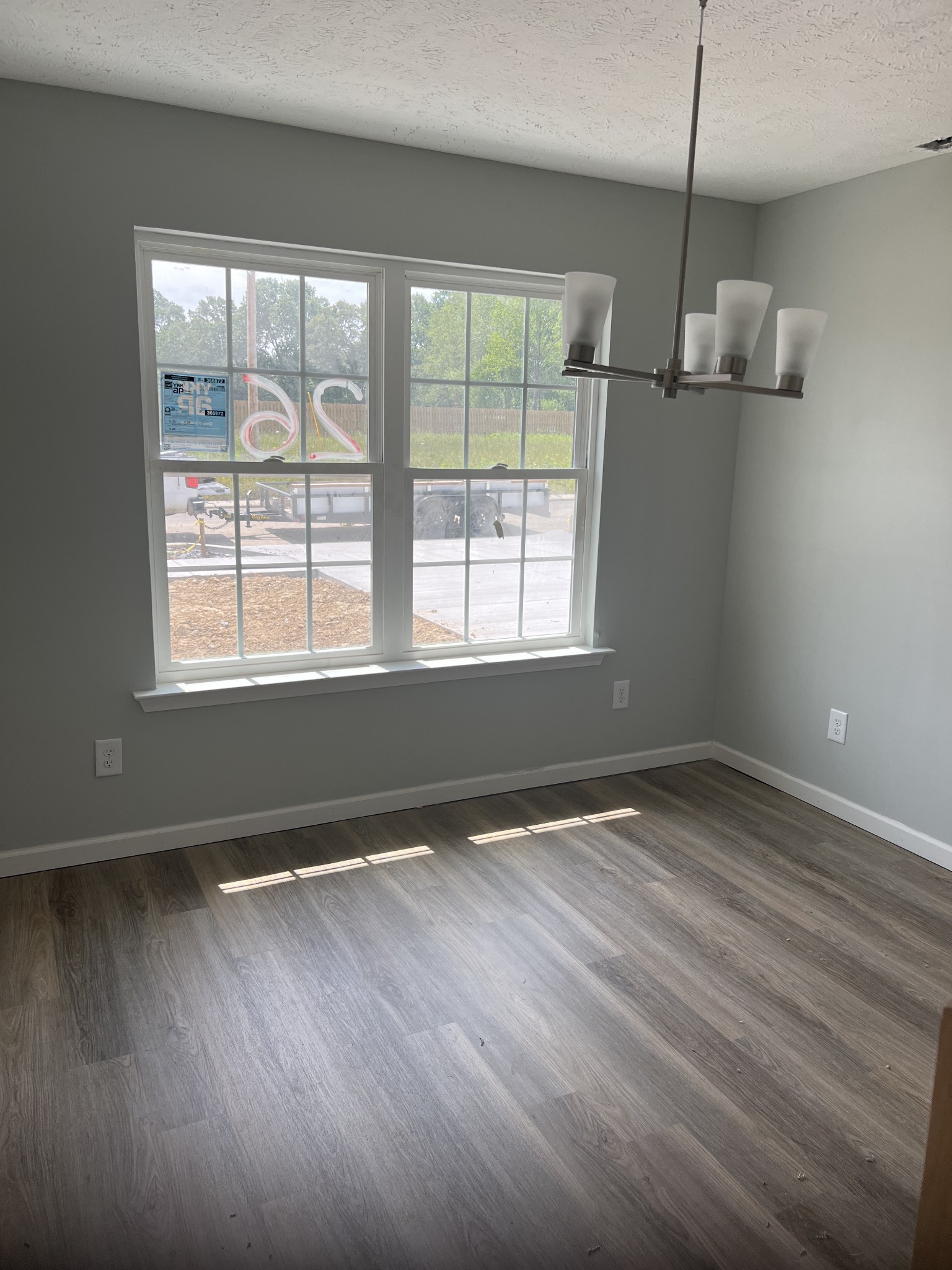 92 Timber Circle Manchester, TN 37355 - Photo 7 of 21 a view of an empty room with wooden floor and a window