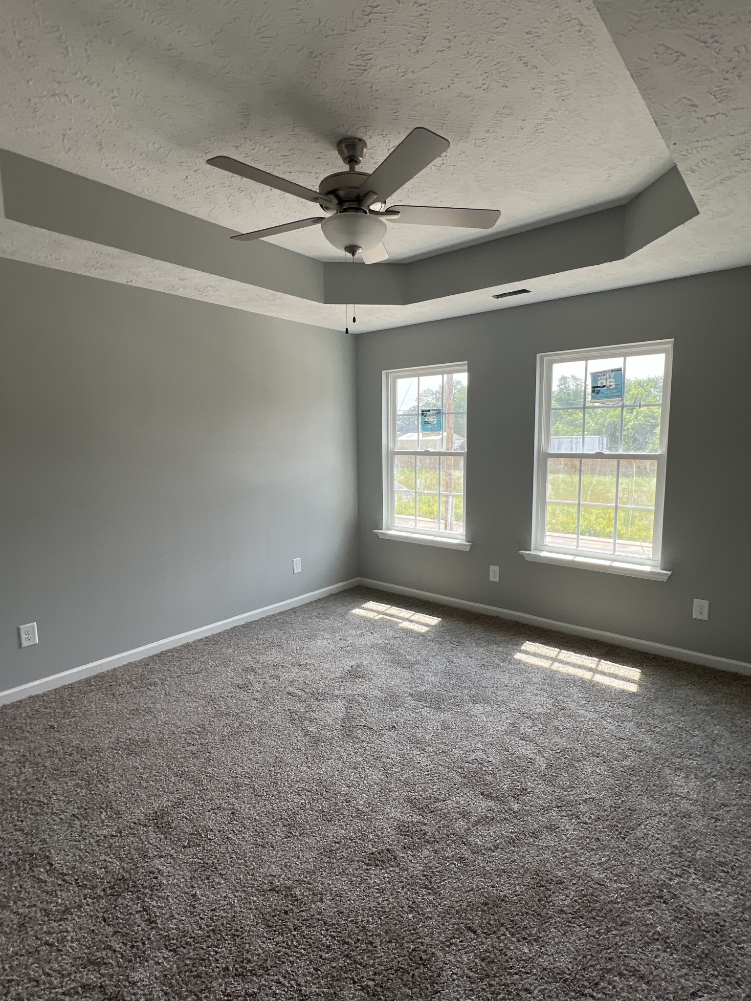 92 Timber Circle Manchester, TN 37355 - Photo 8 of 21 an empty room with a ceiling fan and windows