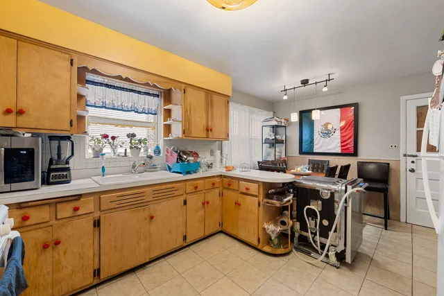 a kitchen with stainless steel appliances granite countertop a sink and cabinets