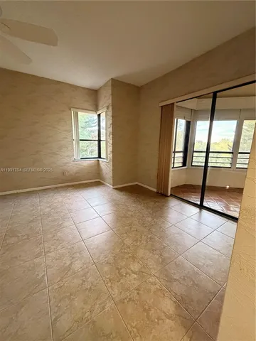 a lobby with furniture and flat screen tv
