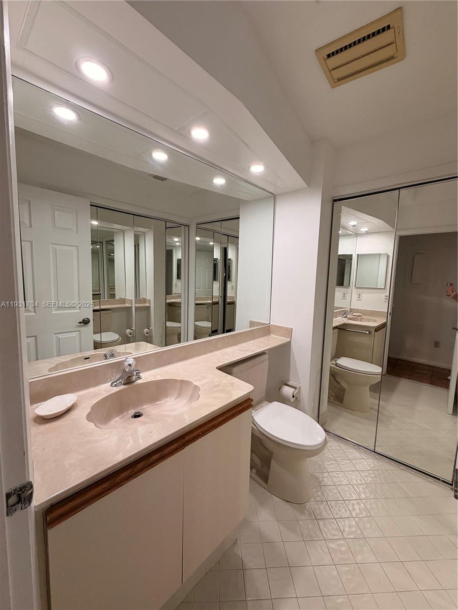 Boca Pointe Boca Raton, FL 33433 - Photo 23 of 32 a bathroom with a sink toilet and a mirror