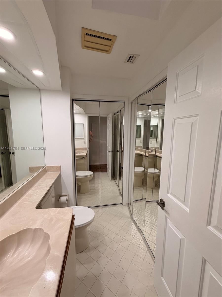 Boca Pointe Boca Raton, FL 33433 - Photo 24 of 32 a bedroom with a bed and a sink