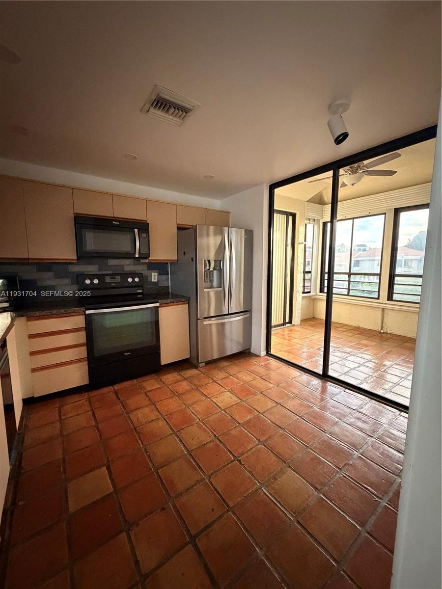 Boca Pointe Boca Raton, FL 33433 - Photo 29 of 32 a view of a kitchen with microwave and cabinets