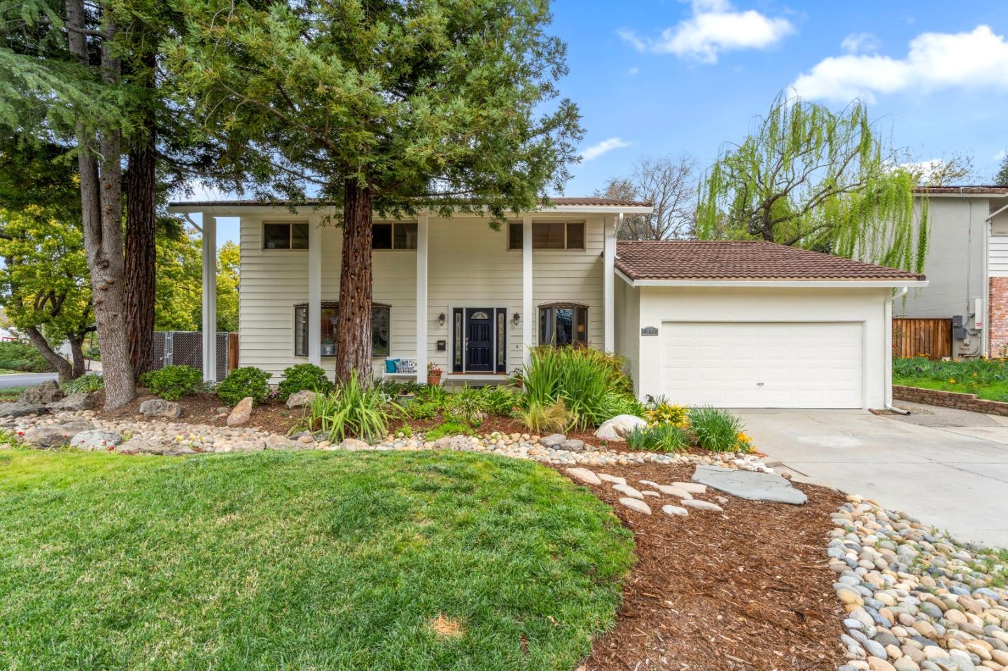 front view of a house with a yard