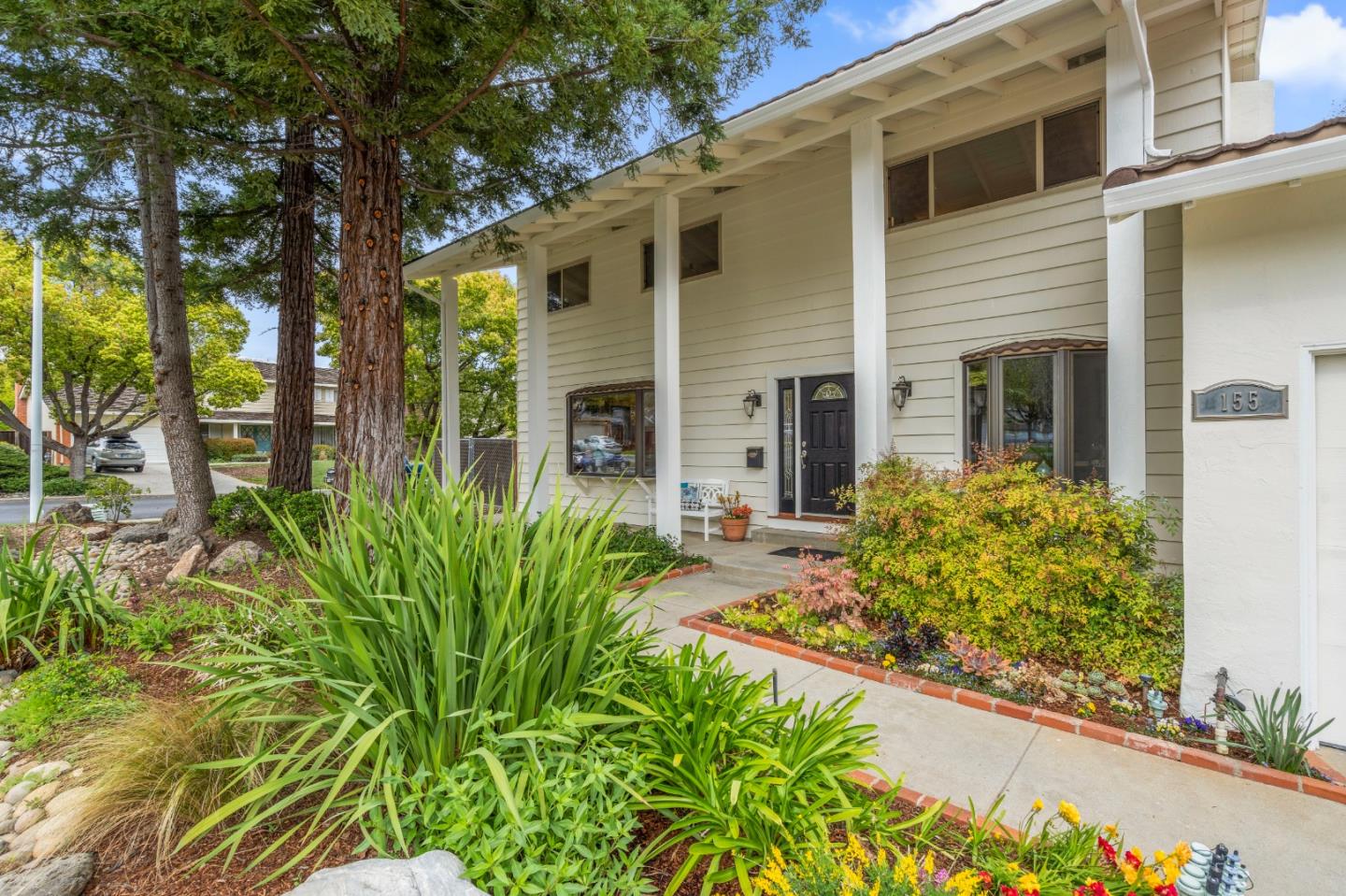 155 Belhaven Drive Los Gatos, CA 95032 - Photo 2 of 30 a front view of a house with garden