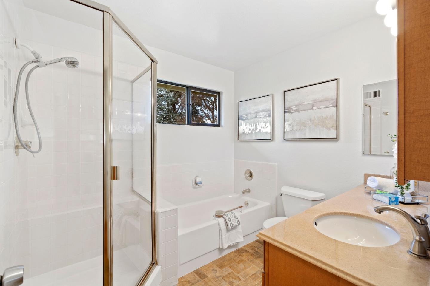 155 Belhaven Drive Los Gatos, CA 95032 - Photo 22 of 30 a bathroom with a granite countertop sink a mirror and a shower