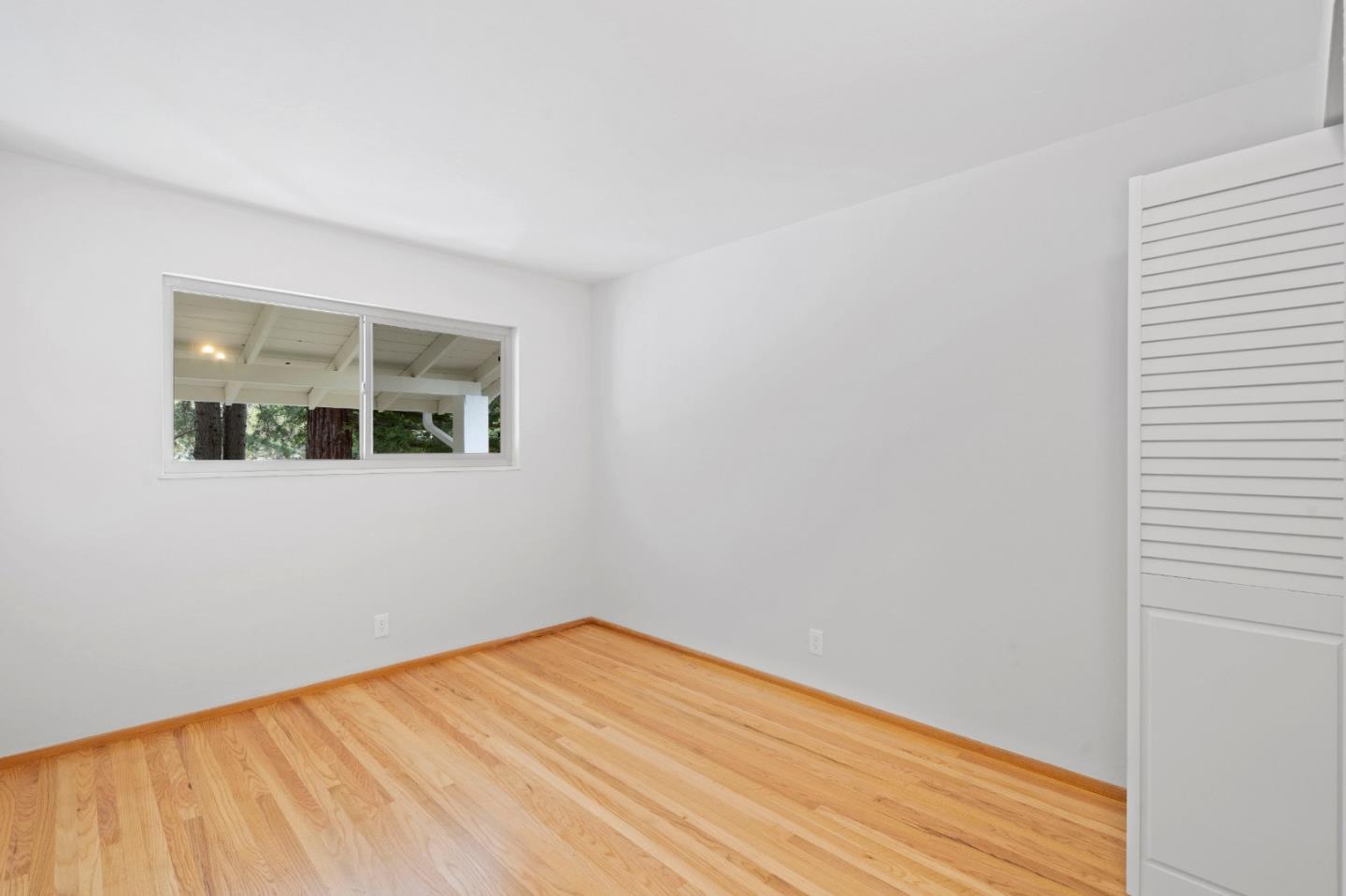 155 Belhaven Drive Los Gatos, CA 95032 - Photo 26 of 30 a view of empty room with wooden floor and fan