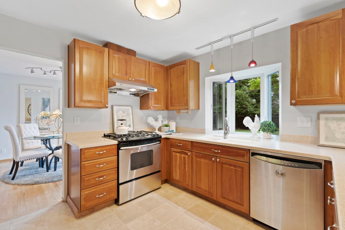 155 Belhaven Drive Los Gatos, CA 95032 - Photo 9 of 30 a kitchen with stainless steel appliances granite countertop a stove and a sink
