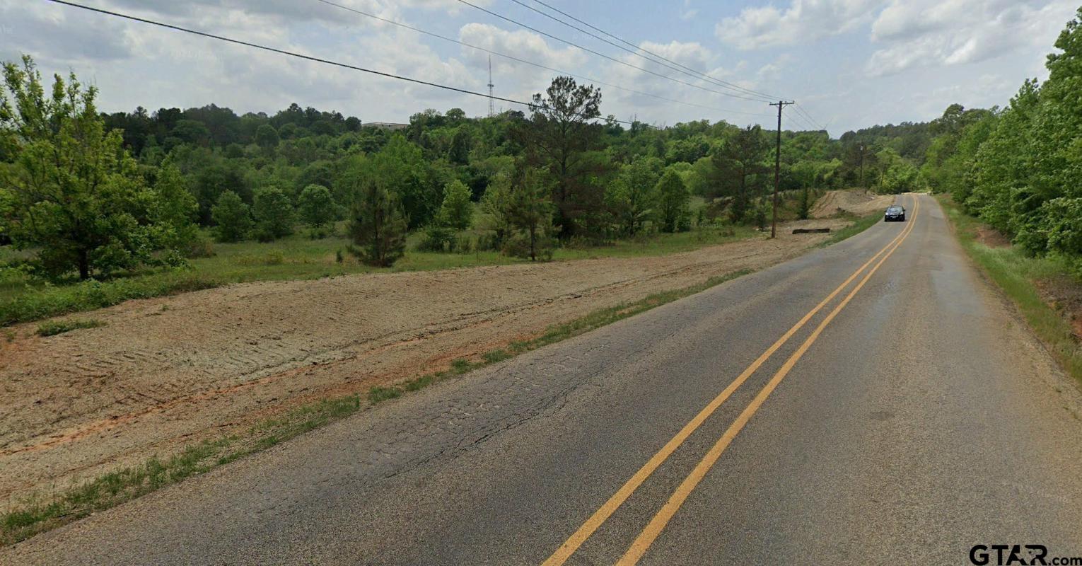 4441 Old Omen Road Tyler, TX 75707 - Photo 6 of 7 a view of a city street with a building in the background