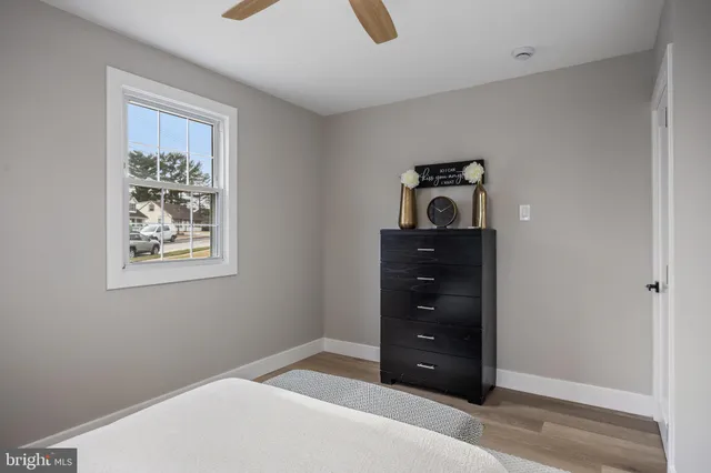 a room with a bed and a mirror