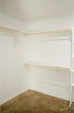 a view of an empty walk in closet