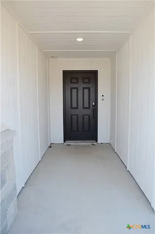 a view of an empty room and closet