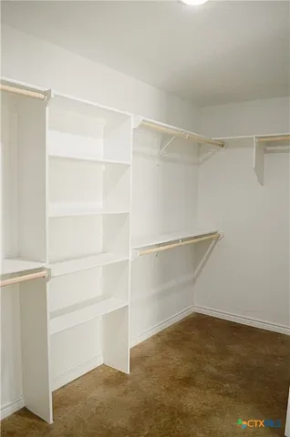 a view of an empty walk in closet