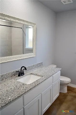 a bathroom with a shower and a bath tub