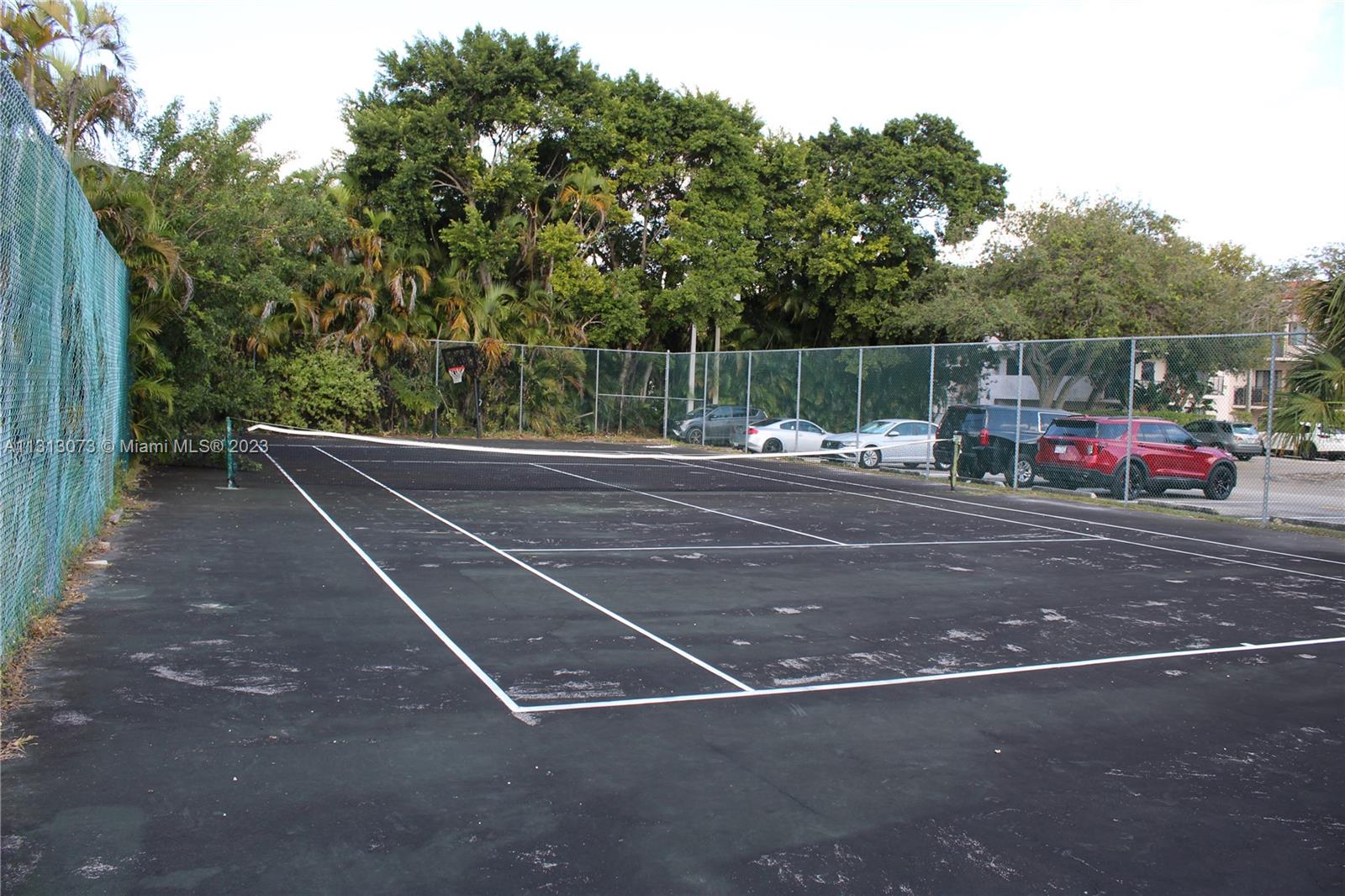 4730 Southwest 62nd Way, Unit 301 Davie, FL 33314 - Photo 17 of 33 a outdoor space with lots of trees