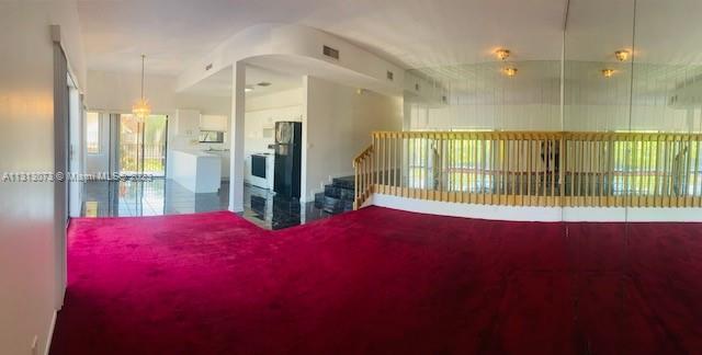 4730 Southwest 62nd Way, Unit 301 Davie, FL 33314 - Photo 21 of 33 a view of an empty room with a balcony