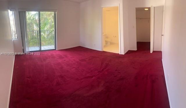 4730 Southwest 62nd Way, Unit 301 Davie, FL 33314 - Photo 25 of 33 an empty room with windows