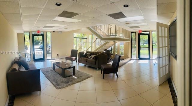 4730 Southwest 62nd Way, Unit 301 Davie, FL 33314 - Photo 32 of 33 a living room with furniture and a large window