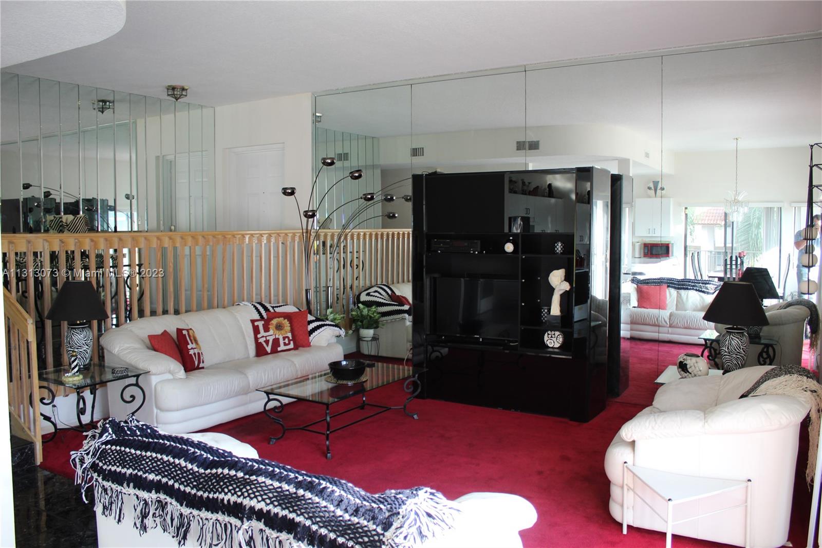 4730 Southwest 62nd Way, Unit 301 Davie, FL 33314 - Photo 4 of 33 a living room with furniture and a rug