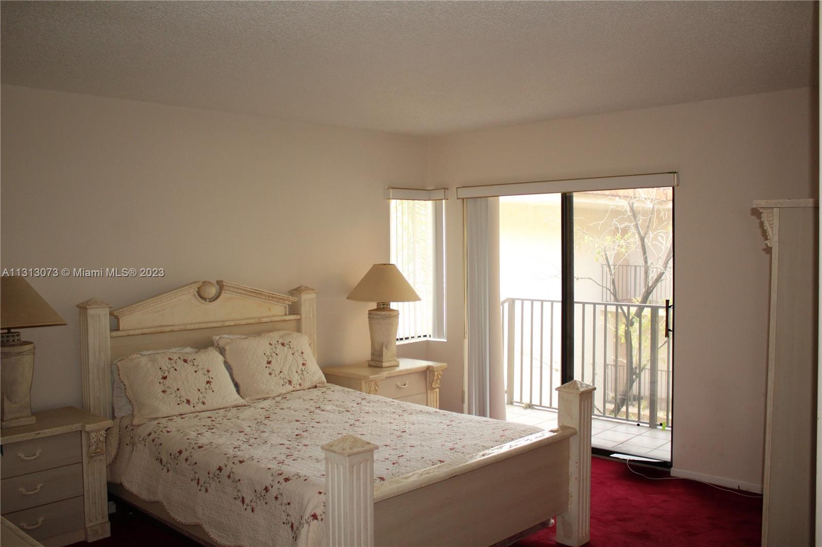 4730 Southwest 62nd Way, Unit 301 Davie, FL 33314 - Photo 7 of 33 a bedroom with a bed and a window