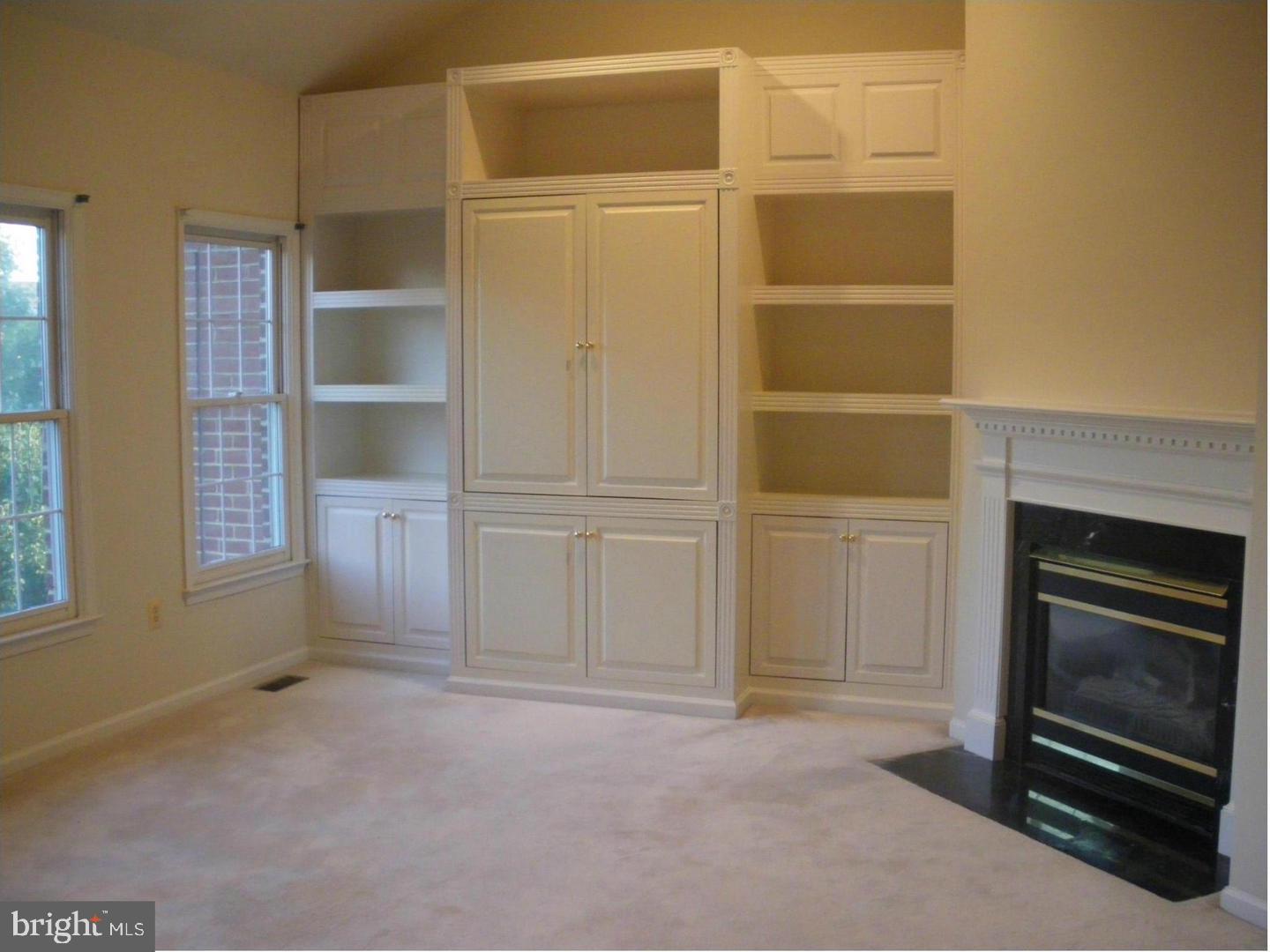 8173 Boss Street Vienna, VA 22182 - Photo 27 of 59 Built-in shelves with Gas fireplace in master BR