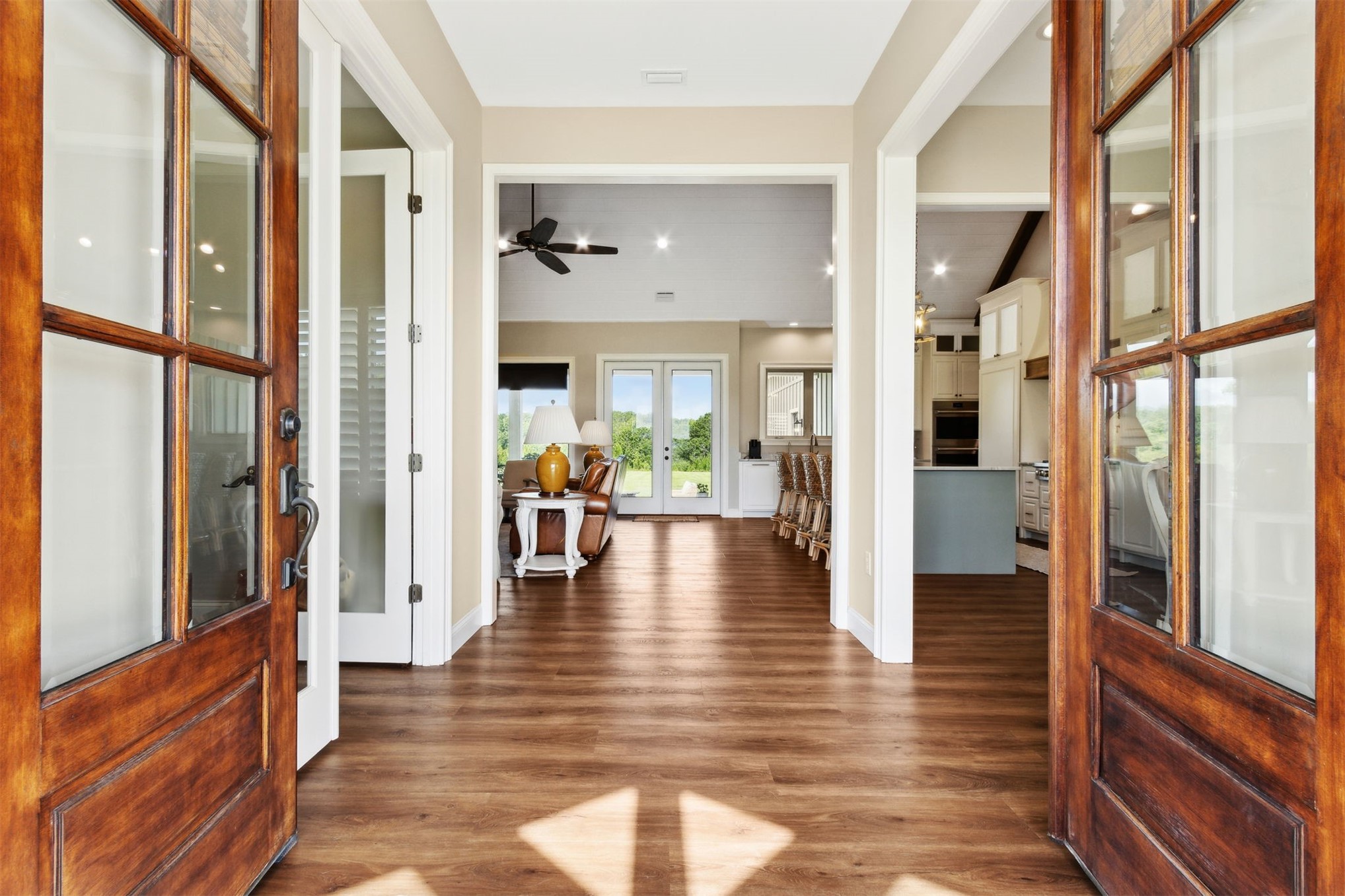 37854 Kings Ferry Road Hilliard, FL 32046 - Photo 15 of 52 a view of an entryway with wooden floor and a living room