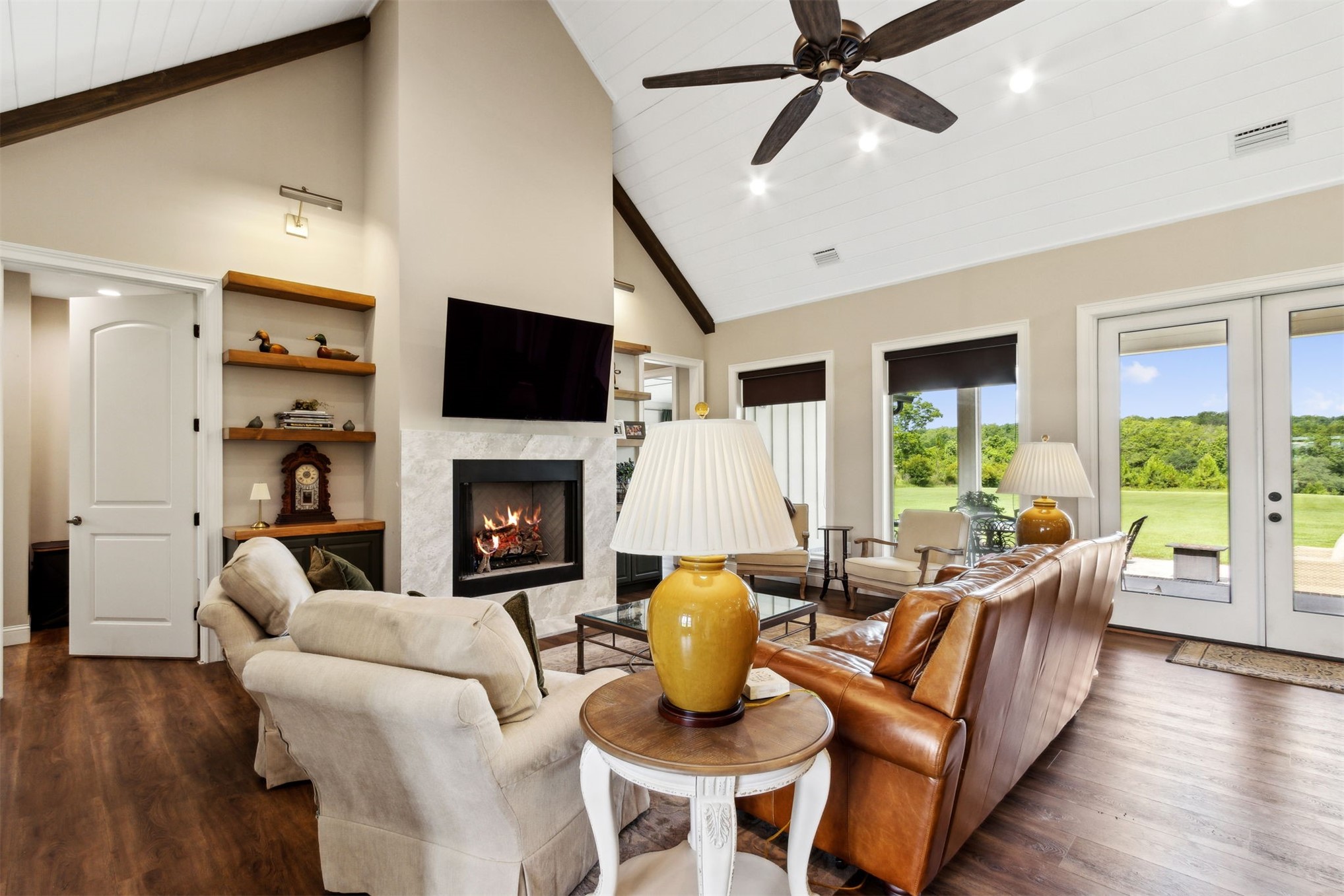 37854 Kings Ferry Road Hilliard, FL 32046 - Photo 18 of 52 a living room with furniture fireplace and a large window