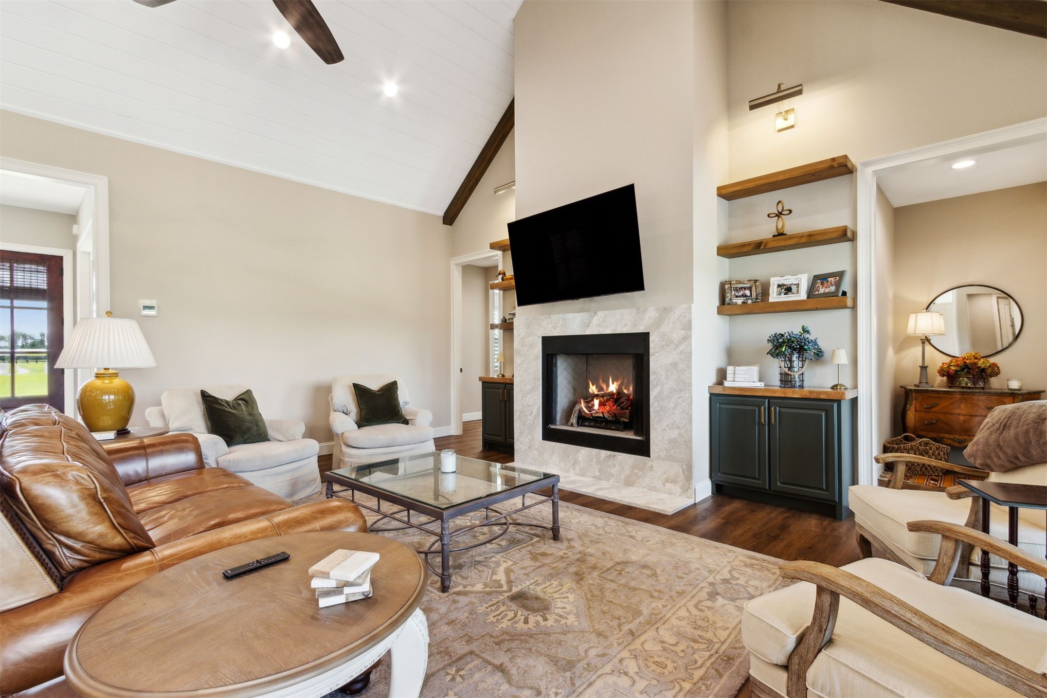 37854 Kings Ferry Road Hilliard, FL 32046 - Photo 20 of 52 a living room with furniture fireplace and a flat screen tv