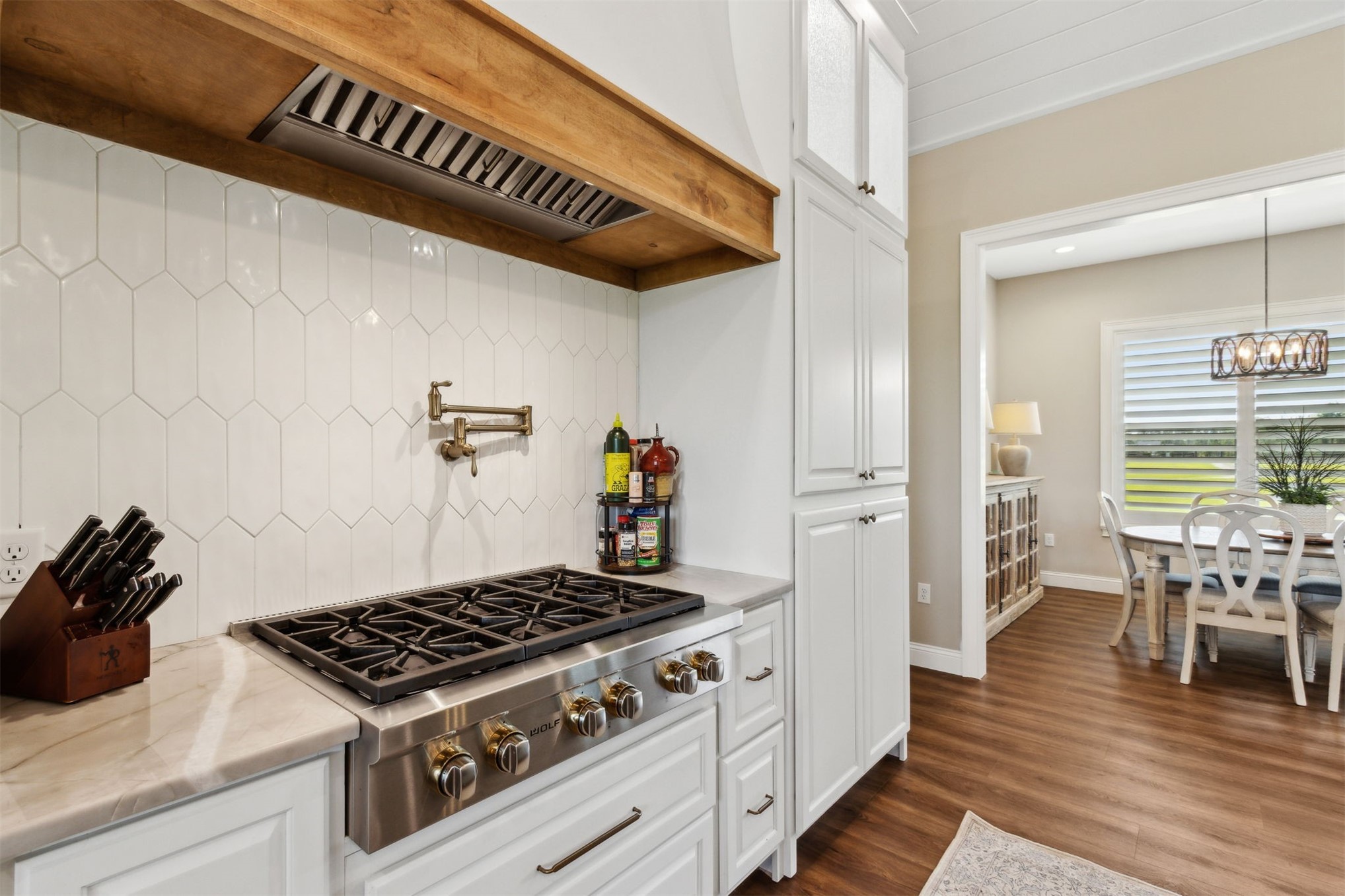 37854 Kings Ferry Road Hilliard, FL 32046 - Photo 24 of 52 a kitchen with a stove and wooden floor