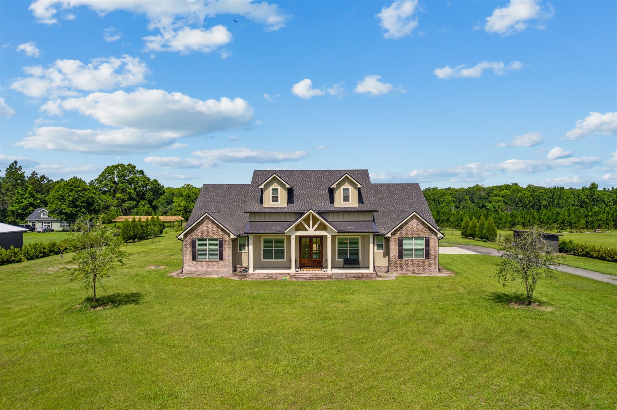 37854 Kings Ferry Road Hilliard, FL 32046 - Photo 3 of 52 a front view of a house with garden