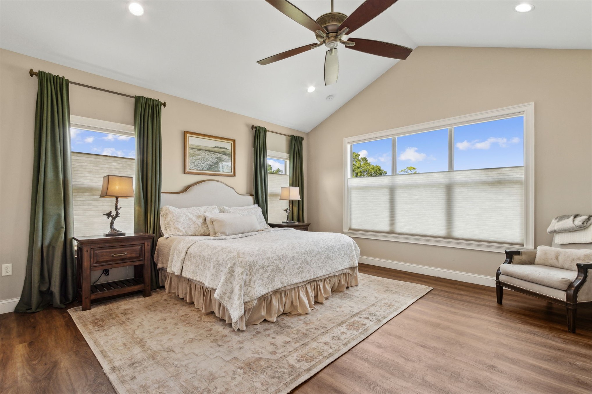 37854 Kings Ferry Road Hilliard, FL 32046 - Photo 31 of 52 a spacious bedroom with a bed a couch and large window