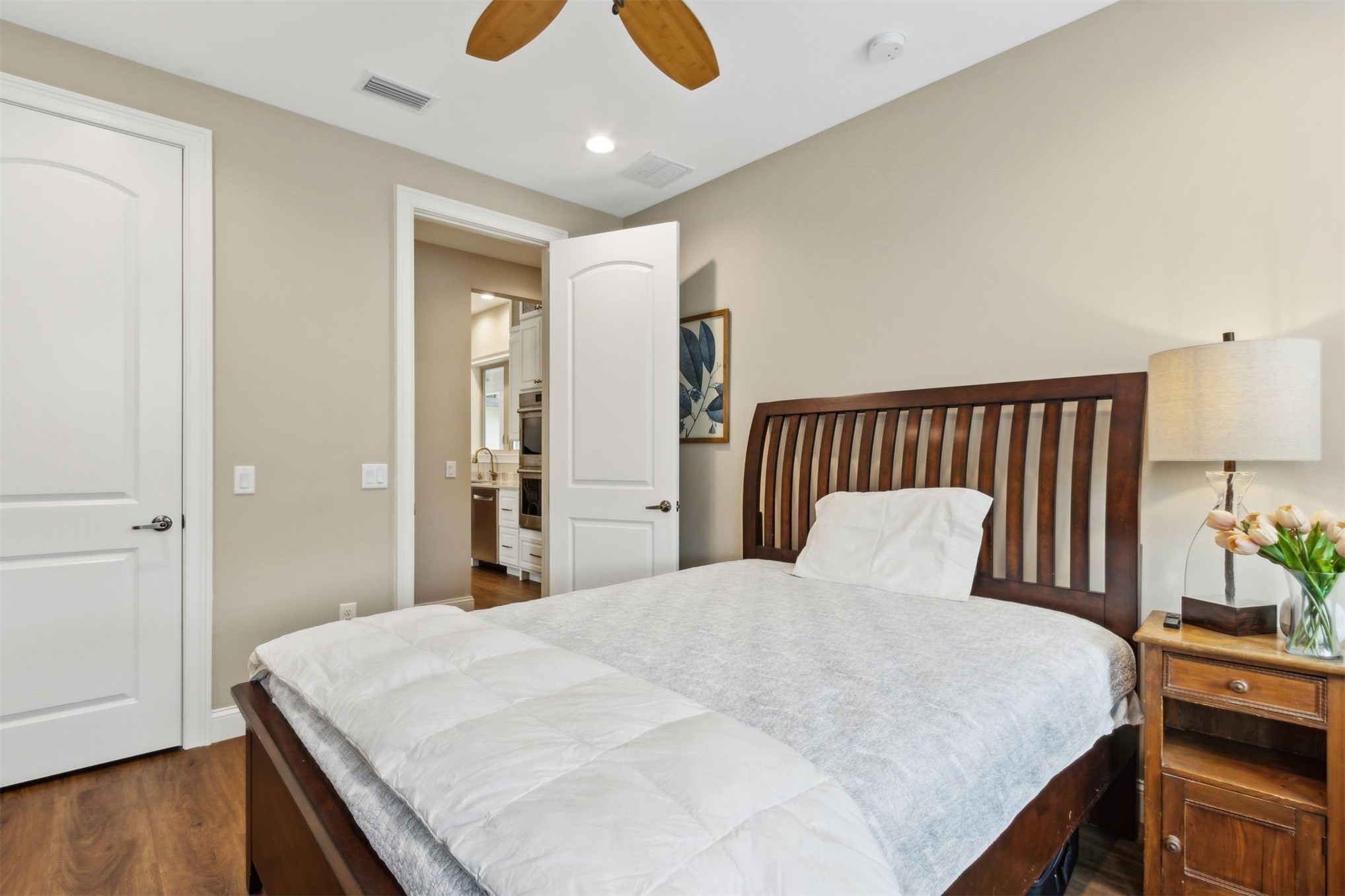 37854 Kings Ferry Road Hilliard, FL 32046 - Photo 37 of 52 a bedroom with a bed and wooden floor